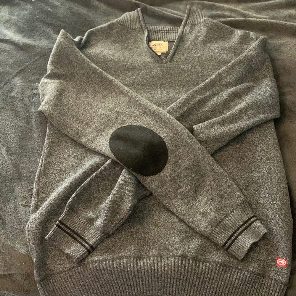 A nice grey sweater that slips up by the neck